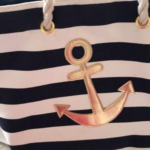 Navy and white striped beach/pool bag with metallic gold anchor and rope handles